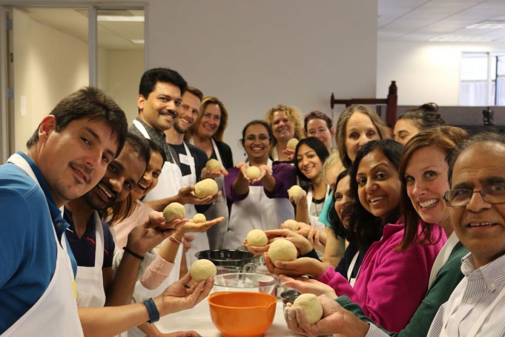 Panchakarma students holding up their basti dough