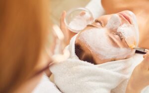 Woman receiving Ayurvedic facial mask